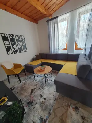 a living room with a couch and a table at OLD HOUSE in Jajce