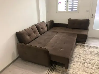 a brown couch sitting in a living room at Apartman 555 in Travnik