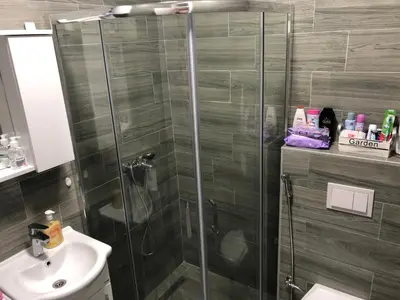 a bathroom with a shower and a sink at Apartman 555 in Travnik