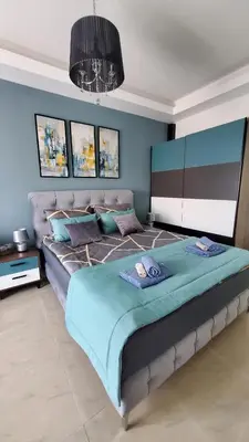 a bedroom with a large bed in a room at Apartman Silver in Bugojno