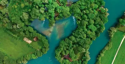 an overhead view of a river in the forest at Summer house LejHana in Bihać
