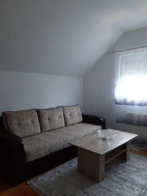 a living room with a couch and a coffee table at Stan na dan Modriča in Modriča