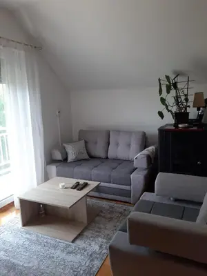 a living room with a couch and a coffee table at Stan na dan Modriča in Modriča