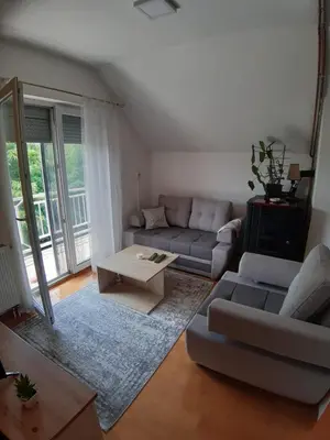 a living room with a couch and a coffee table at Stan na dan Modriča in Modriča