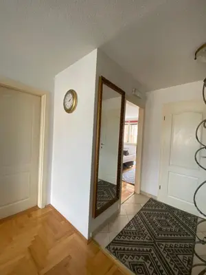 an empty room with a mirror and a door at Capital Apartments Visoko in Visoko