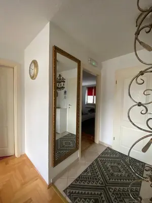 a mirror on a wall in a room at Capital Apartments Visoko in Visoko