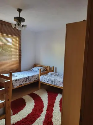 a bedroom with two bunk beds and a rug at Villa Harmony in Bihać