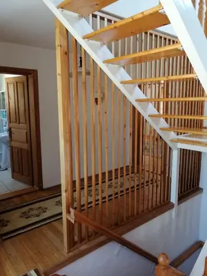 a staircase in a house with wooden railings at Villa Harmony in Bihać