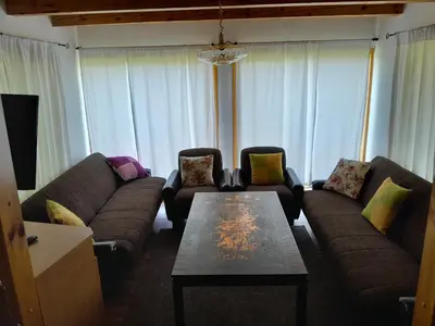 a living room with couches and a coffee table at Vikendica Volar in Prijedor