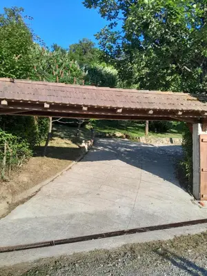 an old wooden bridge with a road under it at Vikendica Volar in Prijedor