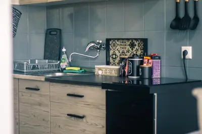 a kitchen with a sink and a counter top at Park Apartment in Visoko