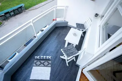 an overhead view of a porch with a table and chairs at Park Apartment in Visoko