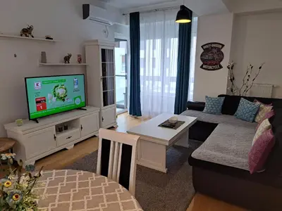 a living room with a couch and a tv at IGX in Banja Luka