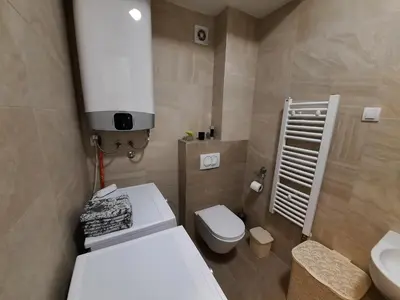 a small bathroom with a toilet and a sink at IGX in Banja Luka