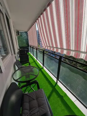 a balcony with a table and chairs on a balcony at Apartment Home Sweet Home in Banja Luka