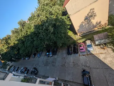an overhead view of a parking lot with cars at Apartment Home Sweet Home in Banja Luka