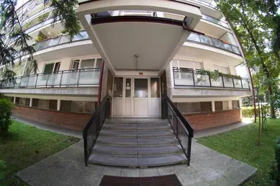 a building with a staircase leading to the front door at Apartment Home Sweet Home in Banja Luka