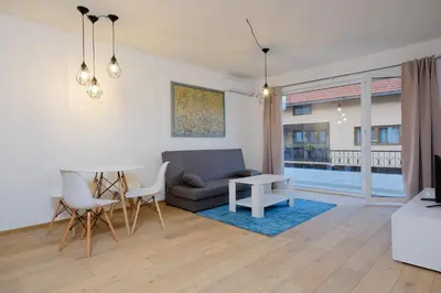a living room with a couch and a table at Unique Apartments Visoko in Visoko