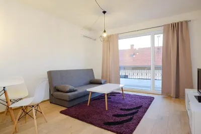 a living room with a couch and a table at Unique Apartments Visoko in Visoko