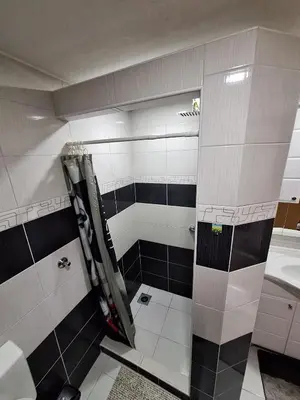 a bathroom with a shower and a sink at Apartman Magic Sauna,Jakuzzi,Kino in Livno