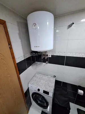 a small bathroom with a toilet and a sink at Apartman Magic Sauna,Jakuzzi,Kino in Livno