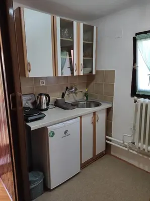 a small kitchen with a sink and a counter at City Center Stay in Visoko
