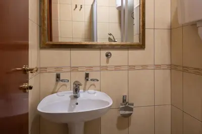 a bathroom with a sink and a mirror at Rio apartments in Banja Luka