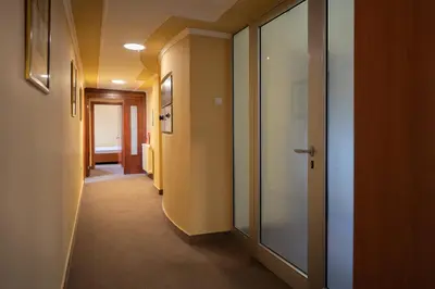 a hallway with a glass door in a building at Rio apartments in Banja Luka