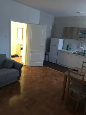 a living room with a couch and a kitchen at Apartmani Golubina - Trn, Laktasi, BANJA LUKA in Grabljani