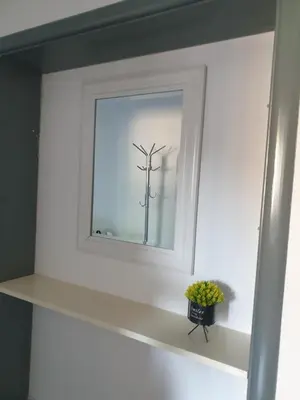 a shelf with a window with a plant in it at Gatto in Jajce