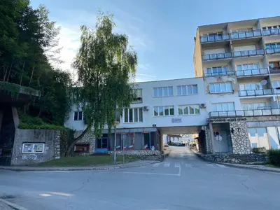an empty street in front of a building at Gatto in Jajce