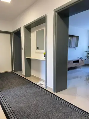 a room with three sliding doors and a mirror at Gatto in Jajce