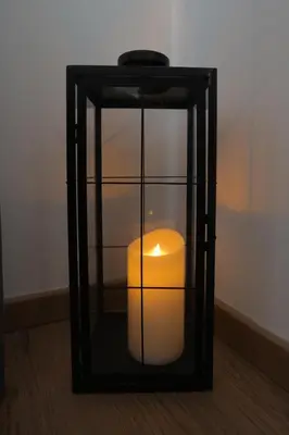 a candle in a glass box on the floor at Apartman Ana in Banja Luka
