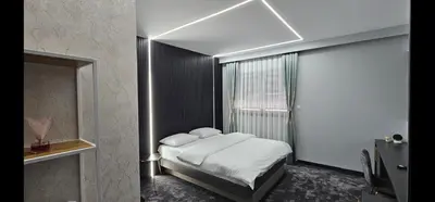 a small bedroom with a bed and a window at Luxury Room 's in Velika Kladuša