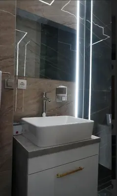 a bathroom with a white sink and a mirror at Luxury Room 's in Velika Kladuša