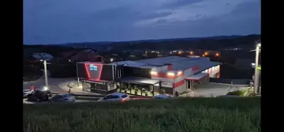 a view of a gas station at night at Luxury Room 's in Velika Kladuša