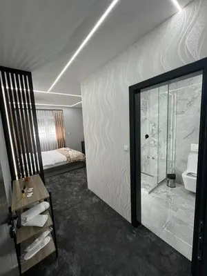 a room with a bathroom with a shower and a bed at Luxury Room 's in Velika Kladuša