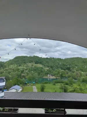 a view of a mountain from a window at Holiday Home Casa Rondo in Bihać