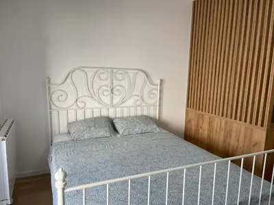 a bedroom with a bed with two pillows on it at Elegance Self check-in Free Parking in Tuzla