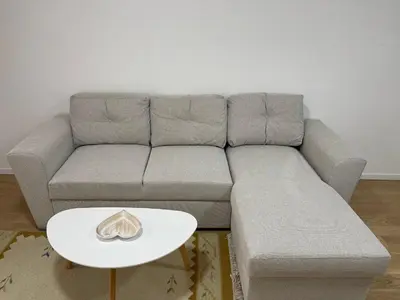 a living room with a gray couch and a white table at Elegance Self check-in Free Parking in Tuzla