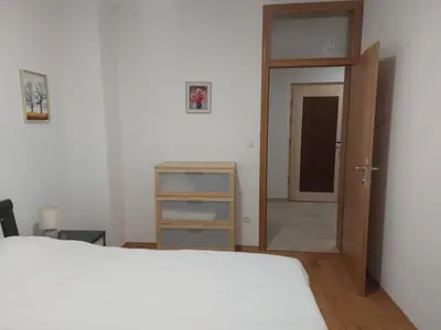 a bedroom with a bed and an open door at Good Vibes in Bihać