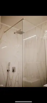 a shower with a glass door in a bathroom at Luxury Apartment in Lukavac