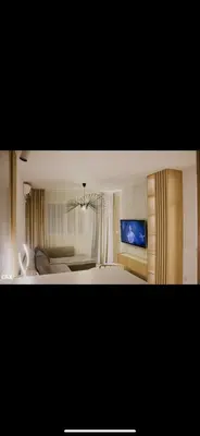 a bedroom with a bed and a television in it at Luxury Apartment in Lukavac
