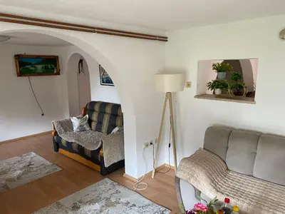 a living room with two chairs and a couch at Kuća za odmor Tarik in Cazin