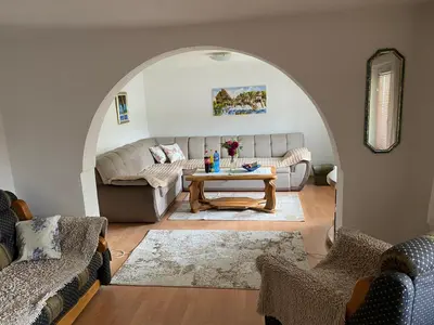 a living room with a couch and a table at Kuća za odmor Tarik in Cazin