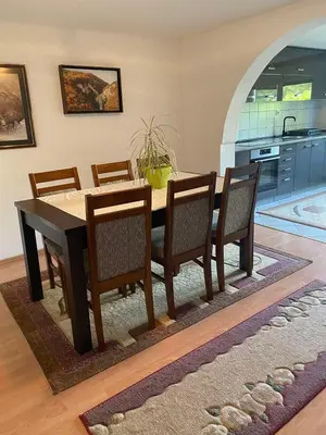 a dining room table and chairs in a kitchen at Kuća za odmor Tarik in Cazin