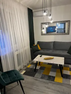 a living room with a couch and a coffee table at Apartman 10 in Banja Luka