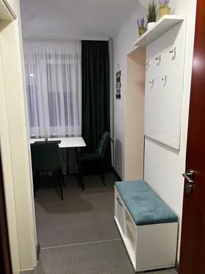a small room with a table and a room with a table at Apartman 10 in Banja Luka
