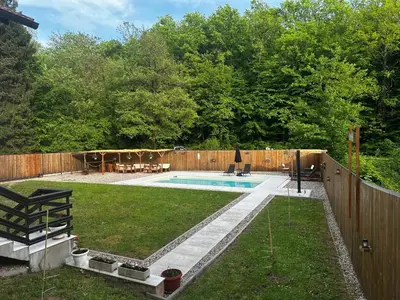a backyard with a pool and a fence at Holiday home with private pool ''Lux Banja Luka'' in Banja Luka