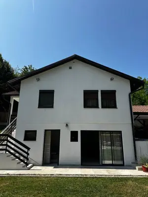 a white house with a black roof at Holiday home with private pool ''Lux Banja Luka'' in Banja Luka